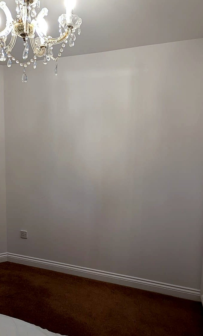 A bare, prepared bedroom wall in Harrogate before the mural was fitted