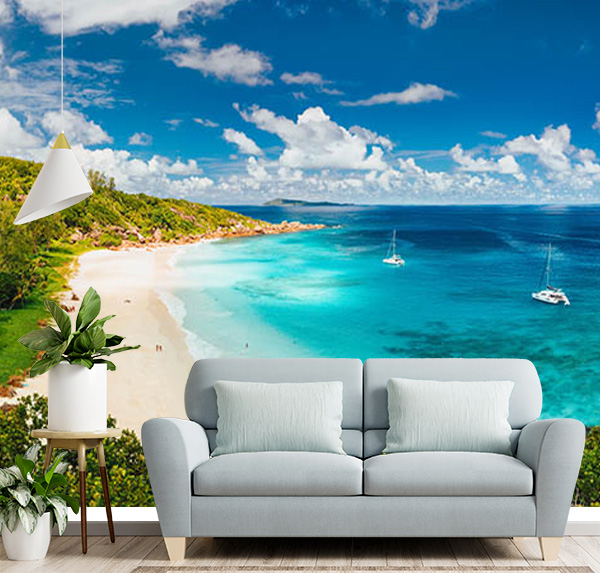 Aerial panoramic shot of Grand Anse beach, La Digue Island, Seychelles with Crystal-clear turquoise waters & pristine white sand beaches
