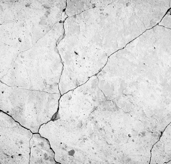 Black and white cracked concrete wall photo—urban, high-res artwork that adds depth, character, and minimalist style to any modern room or gallery wall.